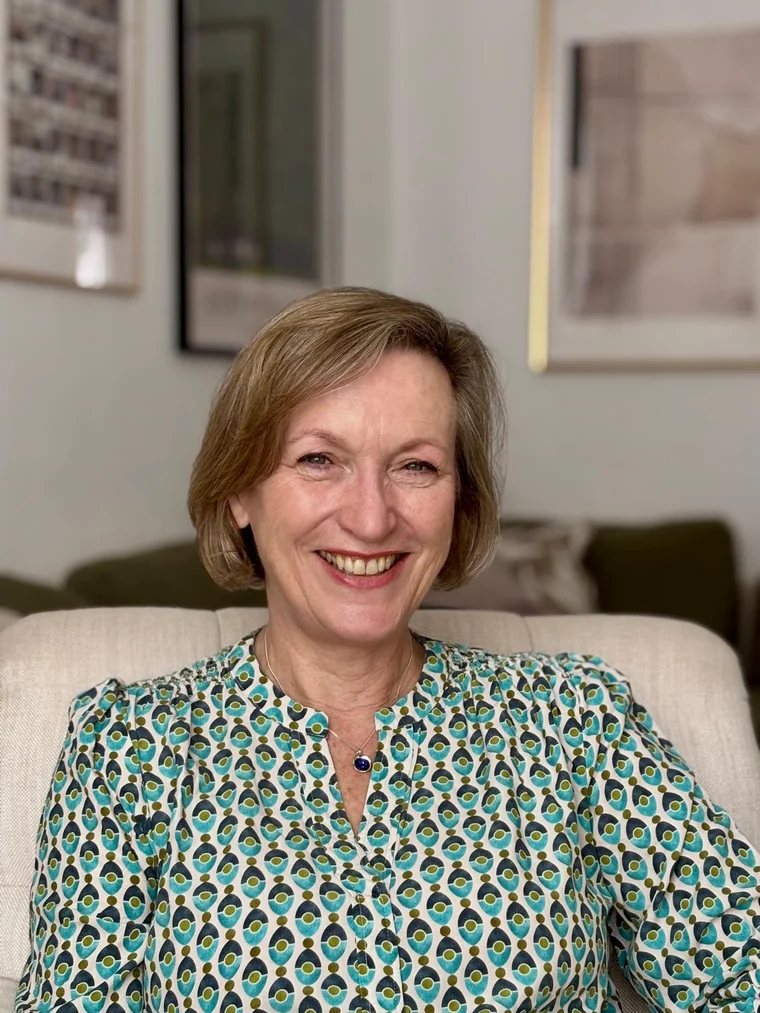 Jayne Uhlig-Ferguson, smiling in her armchair